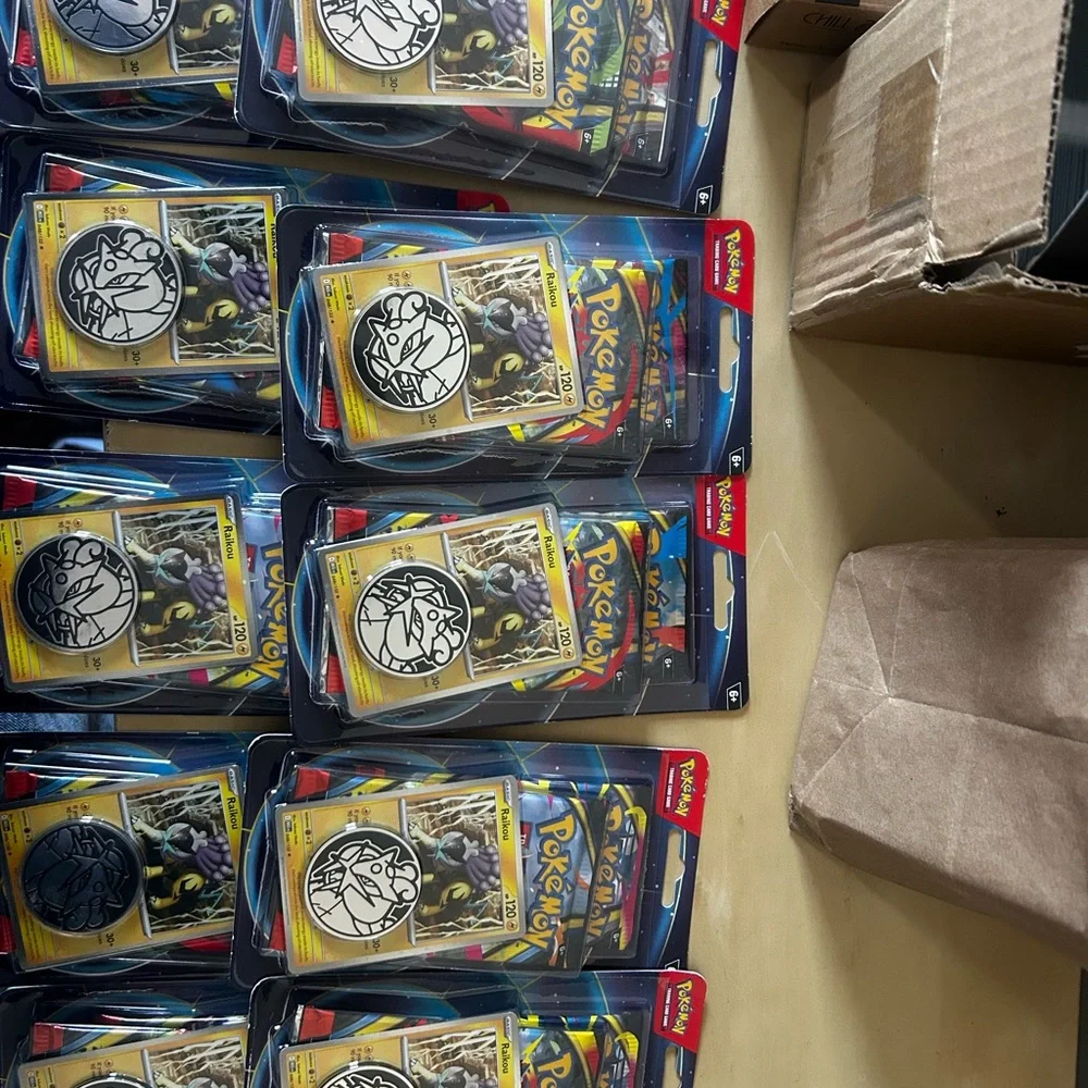 Lot of 10 Pokémon TCG booster double pack with two packs inside featuring Raikou